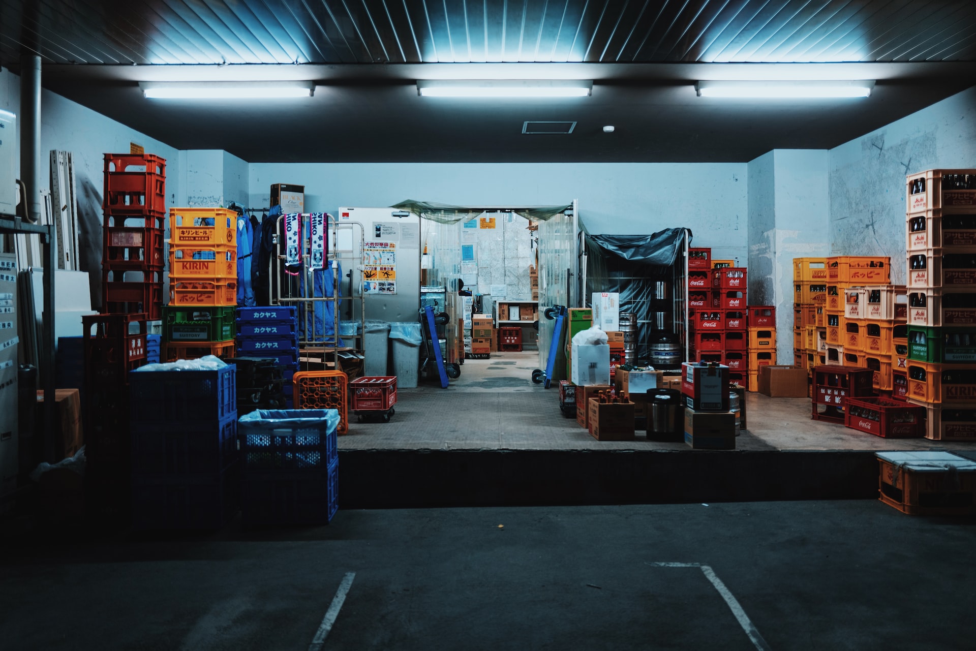 landscape photography of plastic crates in a garage