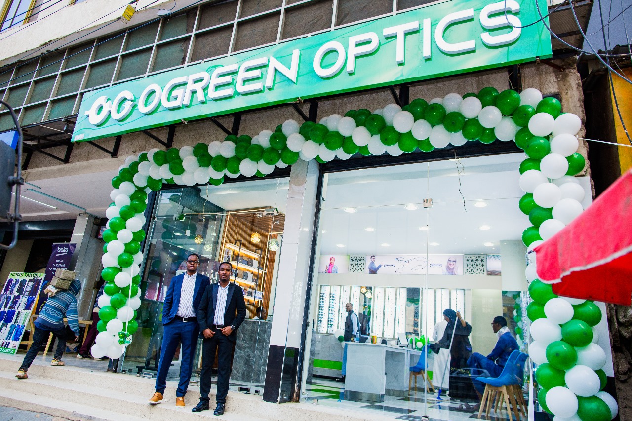 Two men standing in front of Ogreen Optics Store, a client of Blackpaw Innovations